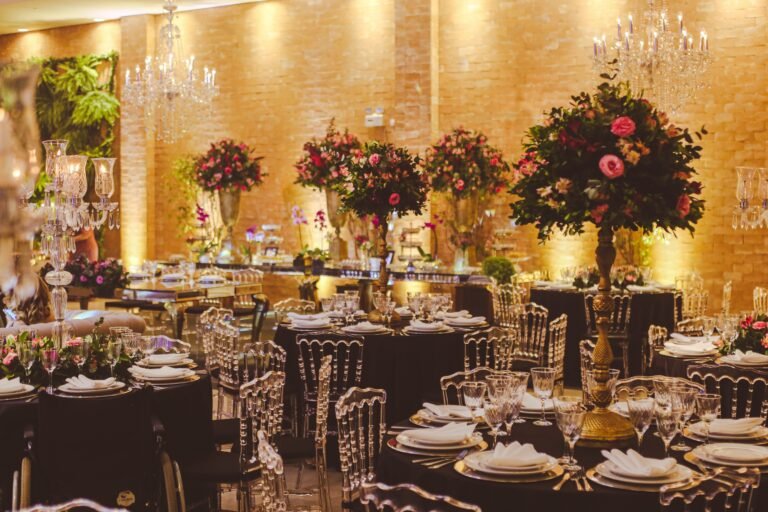 Luxurious event interior with floral arrangements and crystal chandeliers