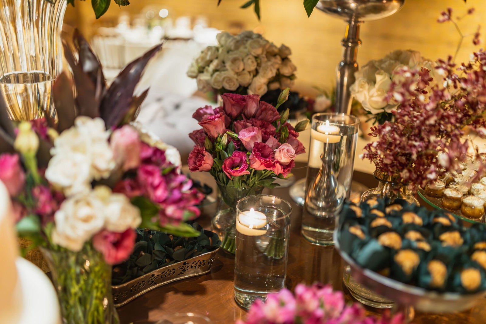 Flowers and candles arranged on a table
