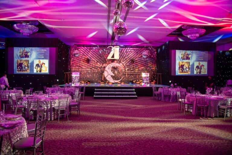Elegant themed event hall with stage and ambient lighting